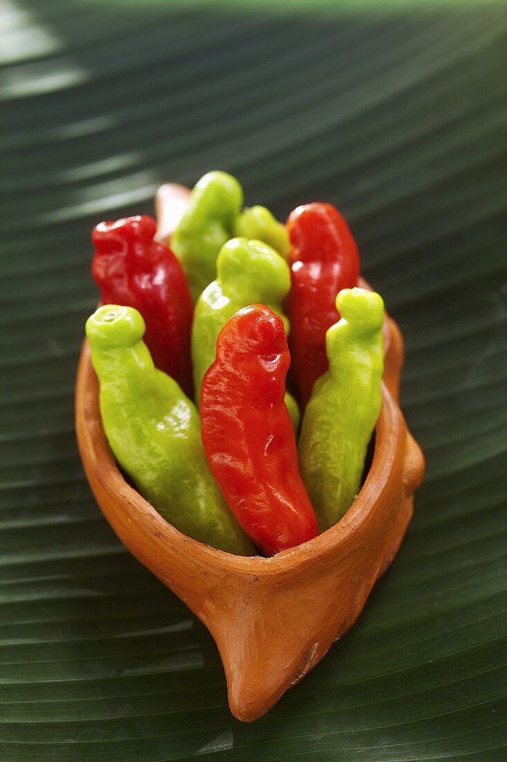 Red and green chillies in a small bowl