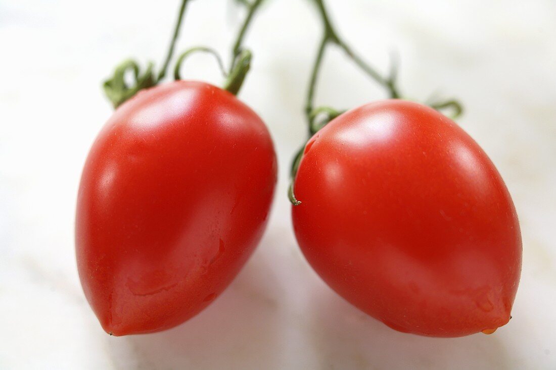 Two plum tomatoes
