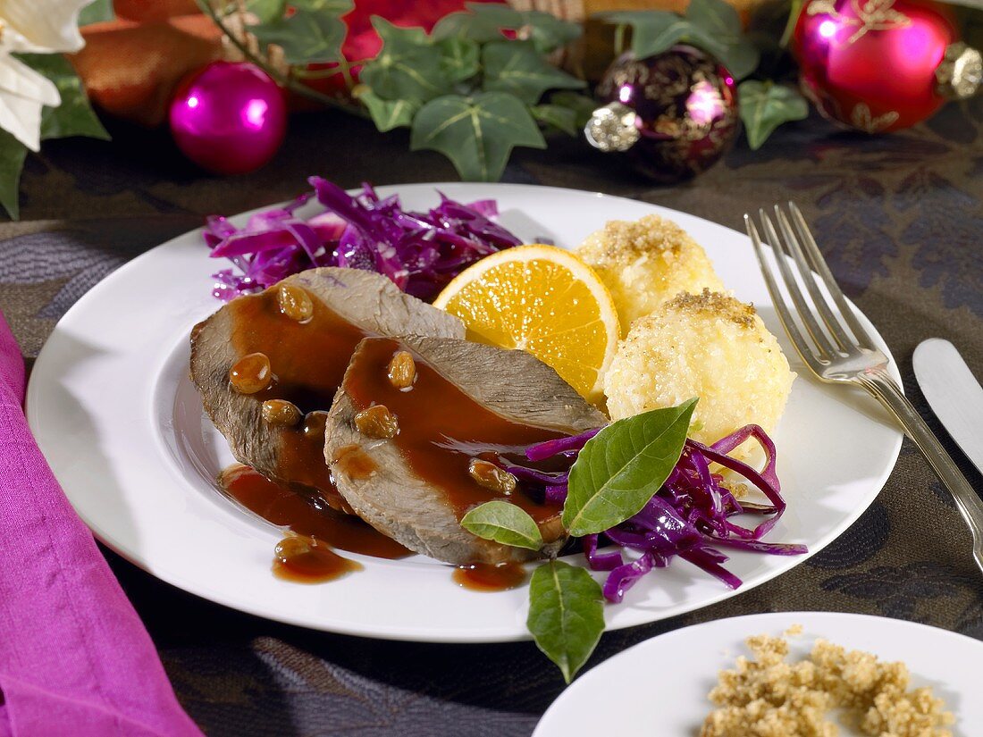 Roast venison with potato dumplings and red cabbage