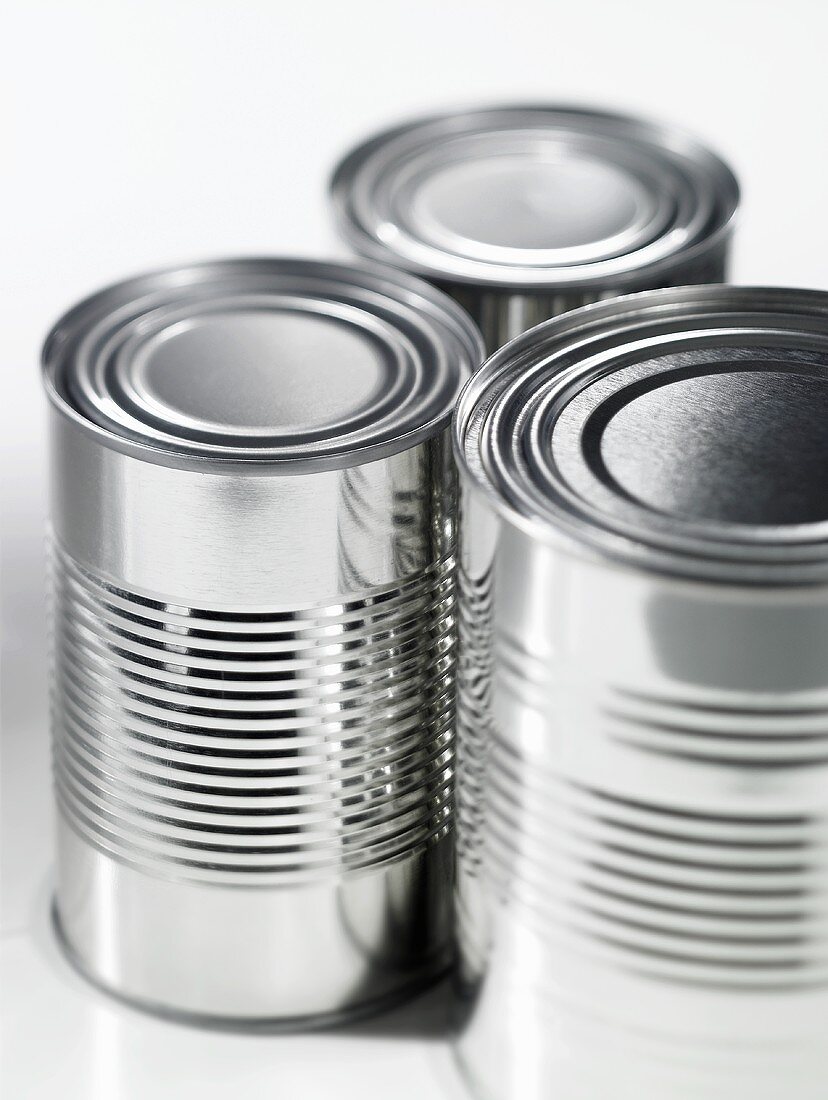 Three food tins without labels