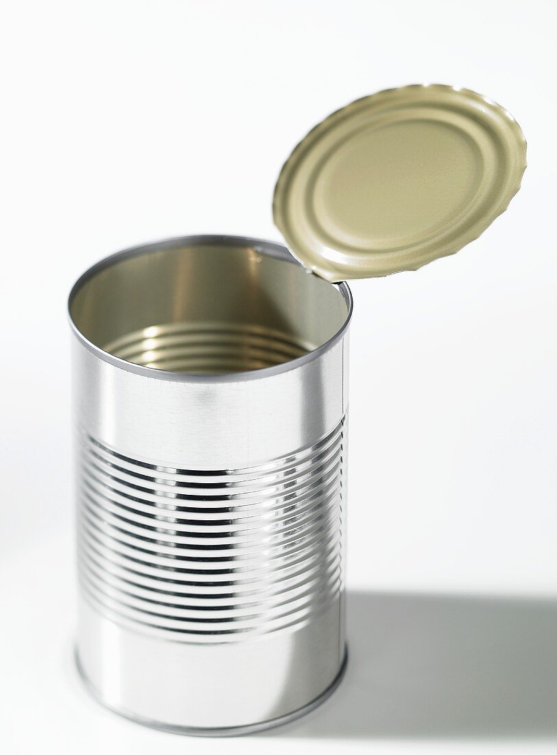 An opened food tin without a label
