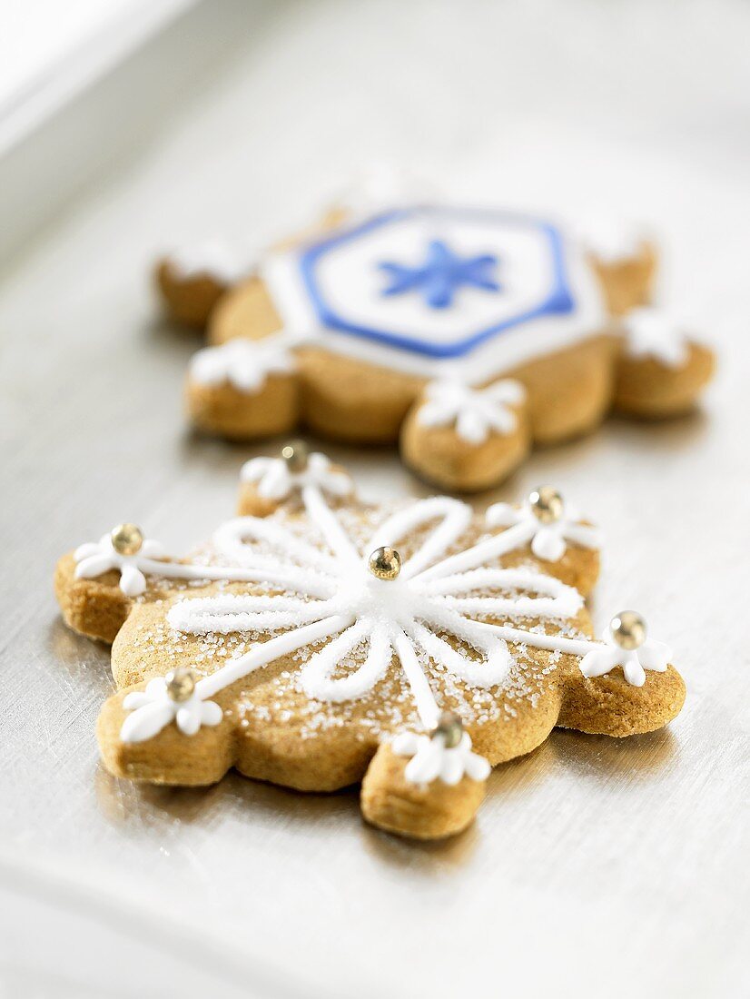 Two decorated Christmas biscuits