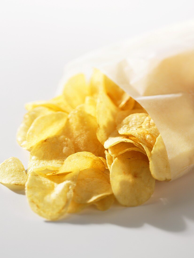 Potato crisps falling out of a bag