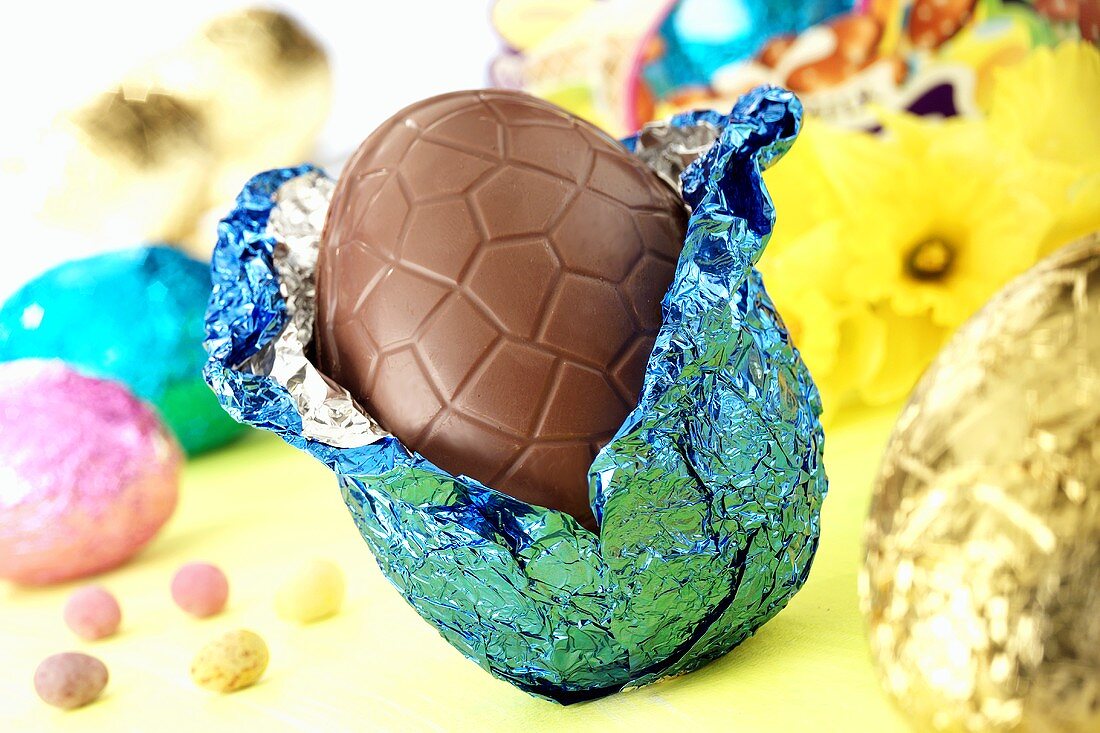 Chocolate Easter egg with opened foil