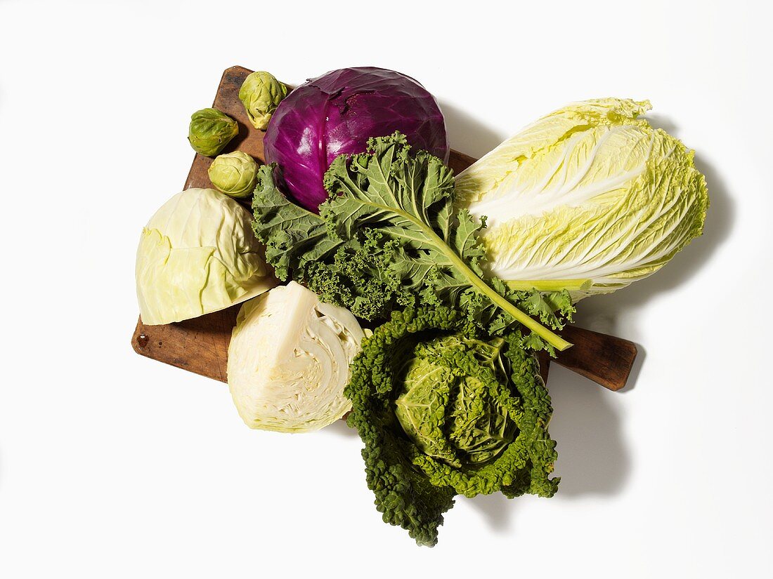 Assorted brassicas on a wooden board