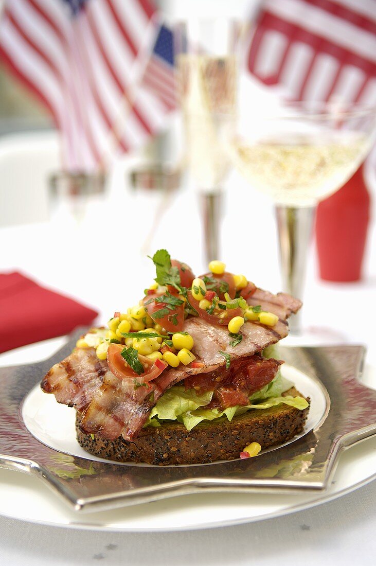 Bread topped with bacon, lettuce, tomato and salsa