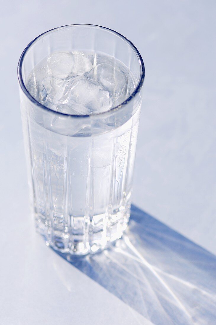 A glass of mineral water with ice cubes