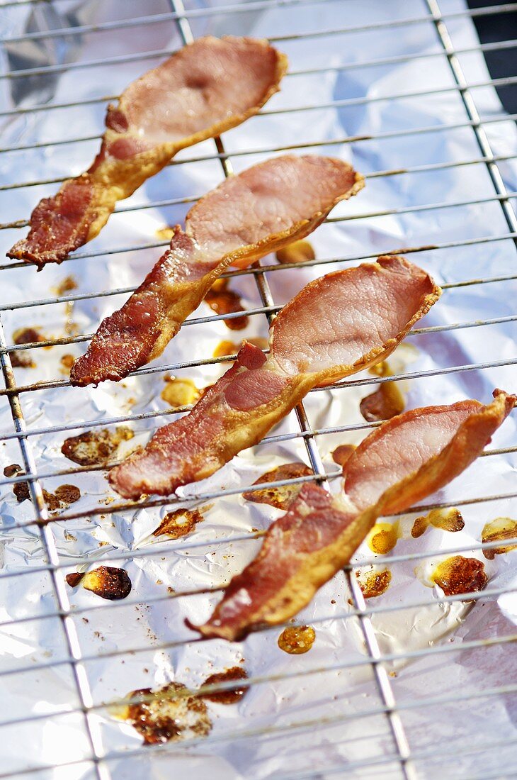 Rashers of fried bacon on a rack
