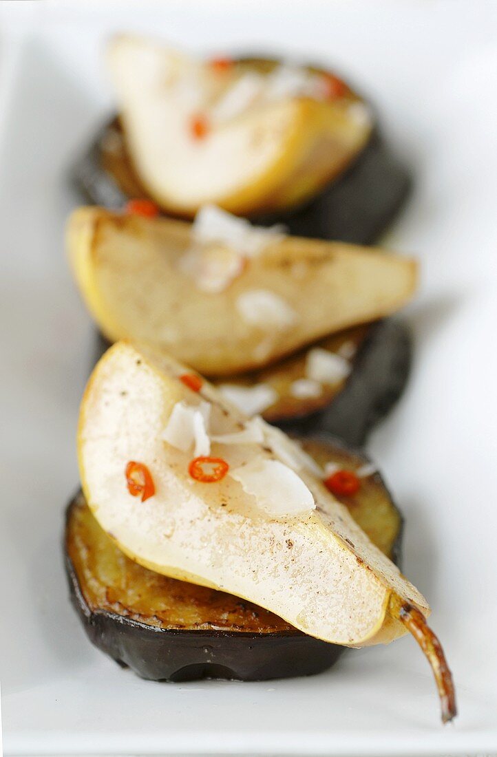 Savoury pears with coconut on fried aubergine slices