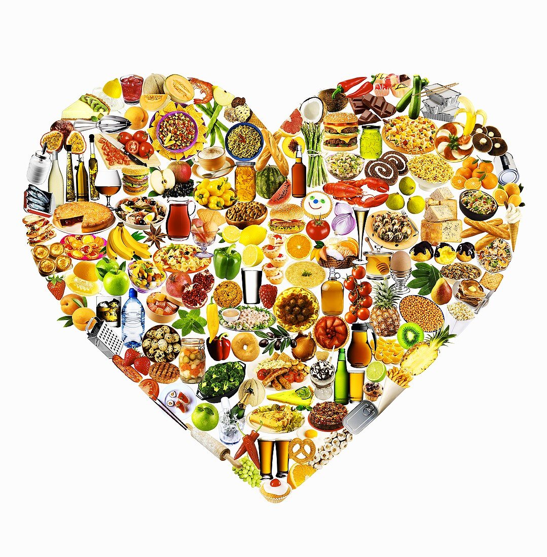 Colourful mixture of foods and dishes forming a heart