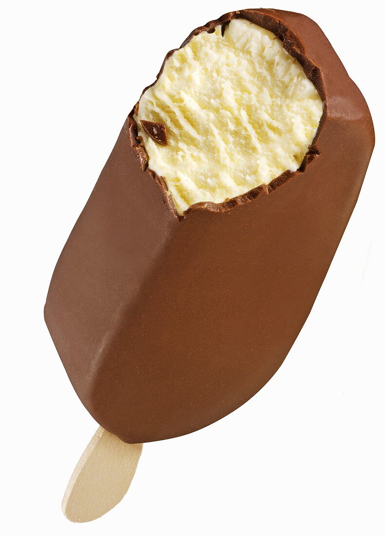 A chocolate-coated vanilla ice cream on a stick