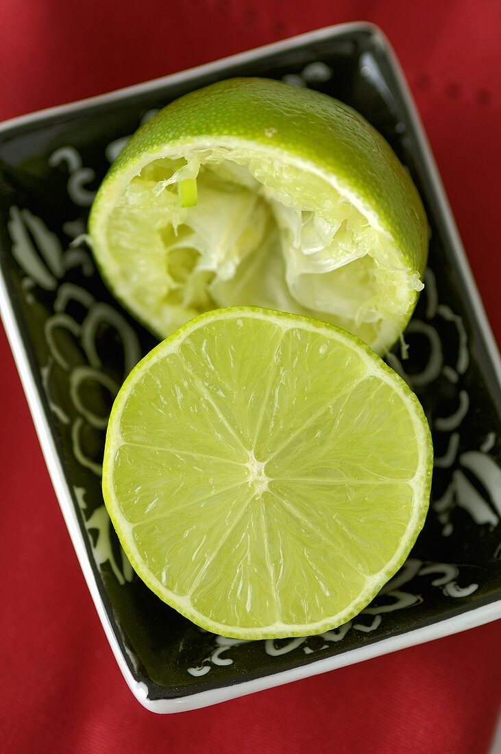 Halved lime, one half squeezed