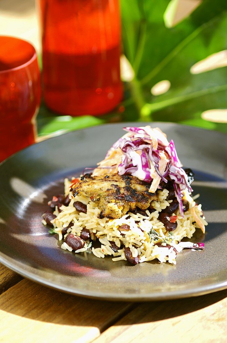 Grilled chicken on rice and beans with red cabbage salad