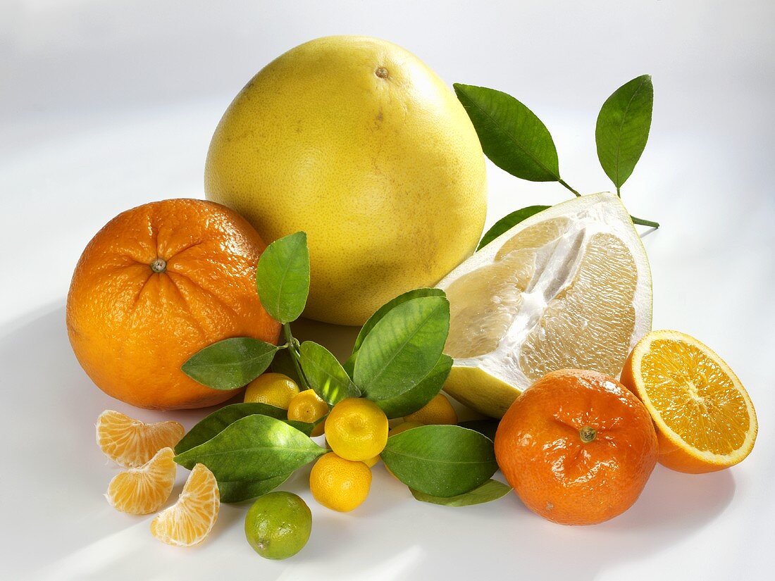 Assorted citrus fruit with leaves