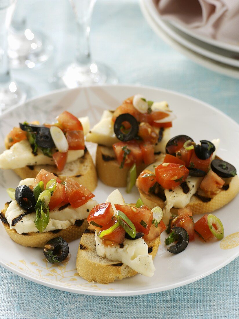 Halloumi cheese & tomato salad on grilled baguette slices