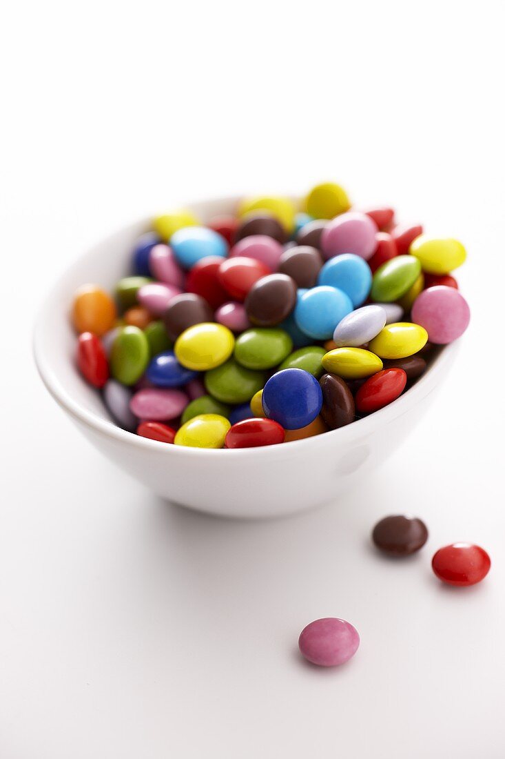 Coloured chocolate beans in a small bowl