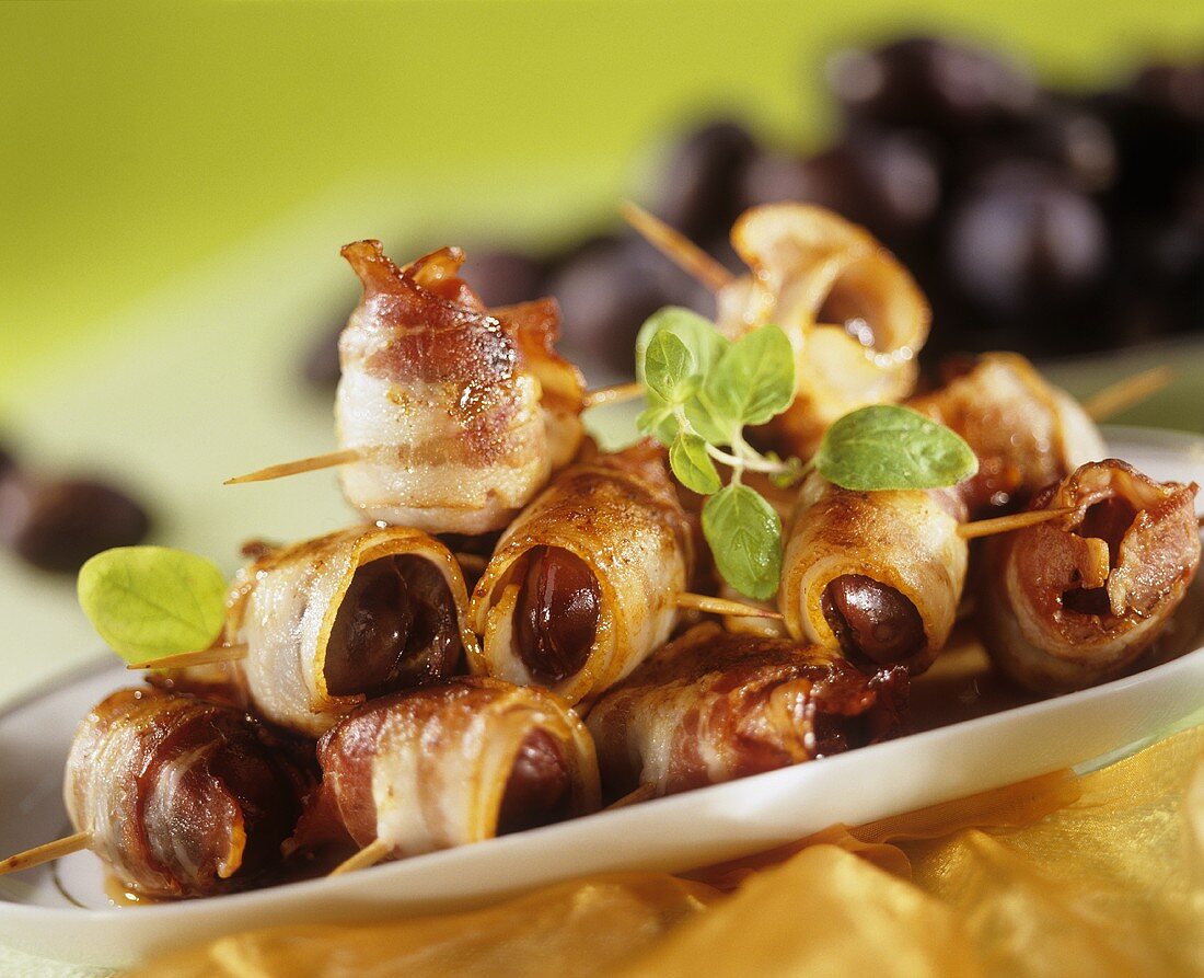 Bacon-wrapped prunes on a platter