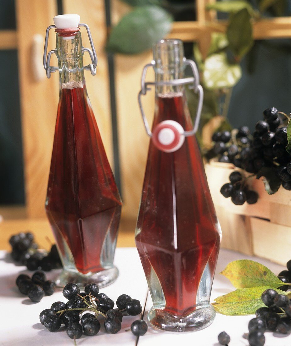 Chokeberry juice in two bottles