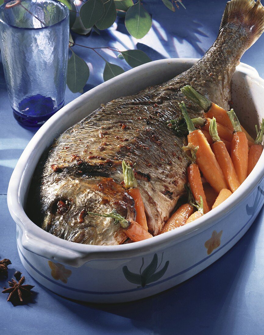 Baked sea bream with carrots