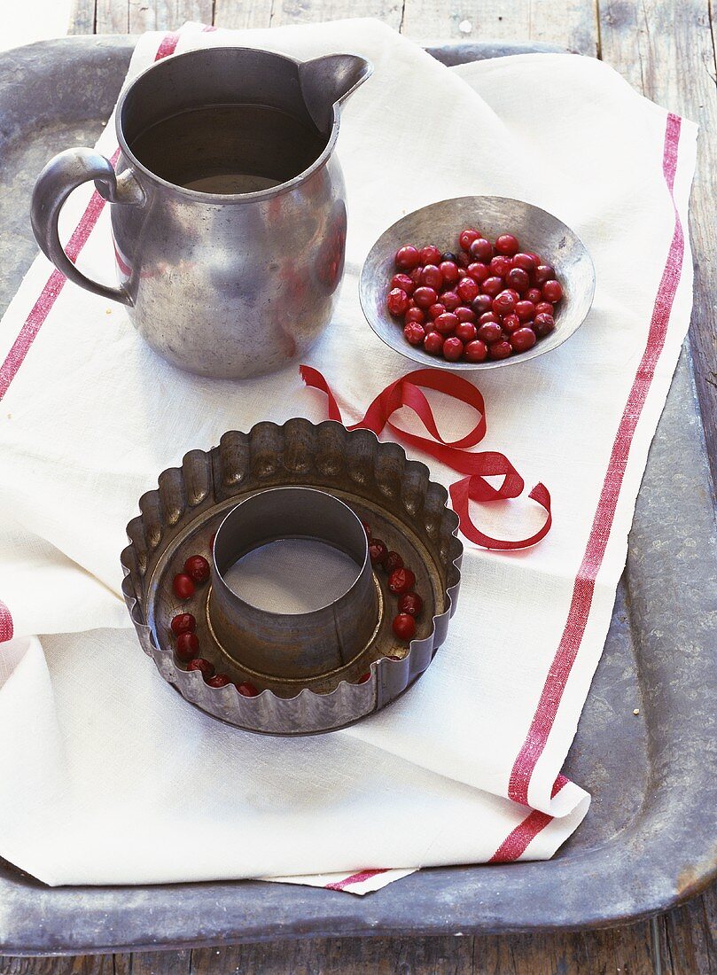 Cranberries in cake tin and small dish