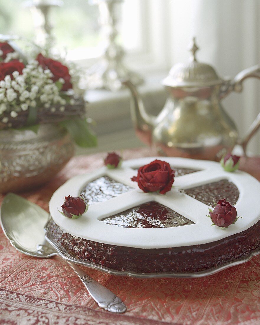 Almond cake with raspberry glaze and marzipan