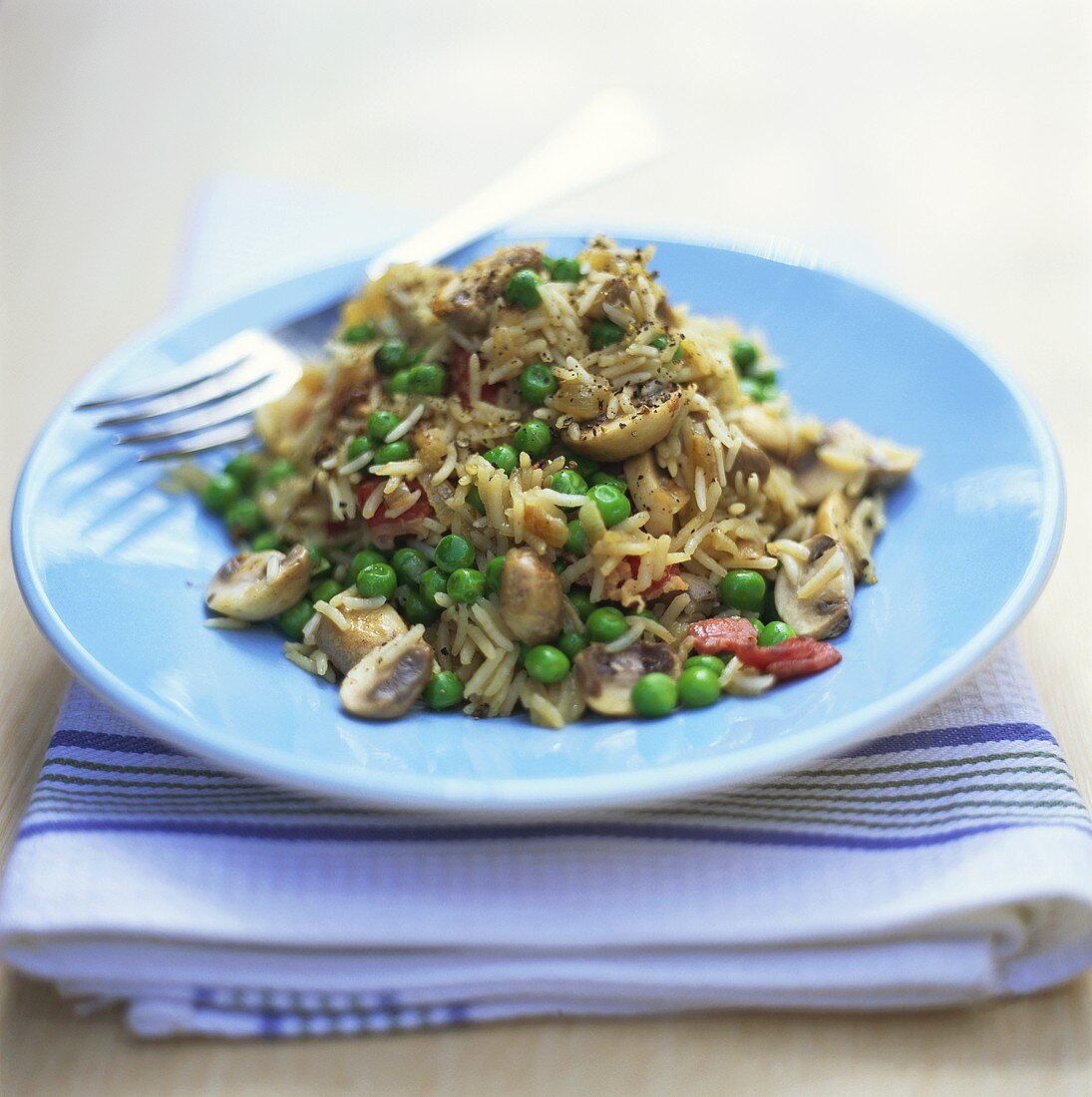 Fried rice with mushrooms and peas