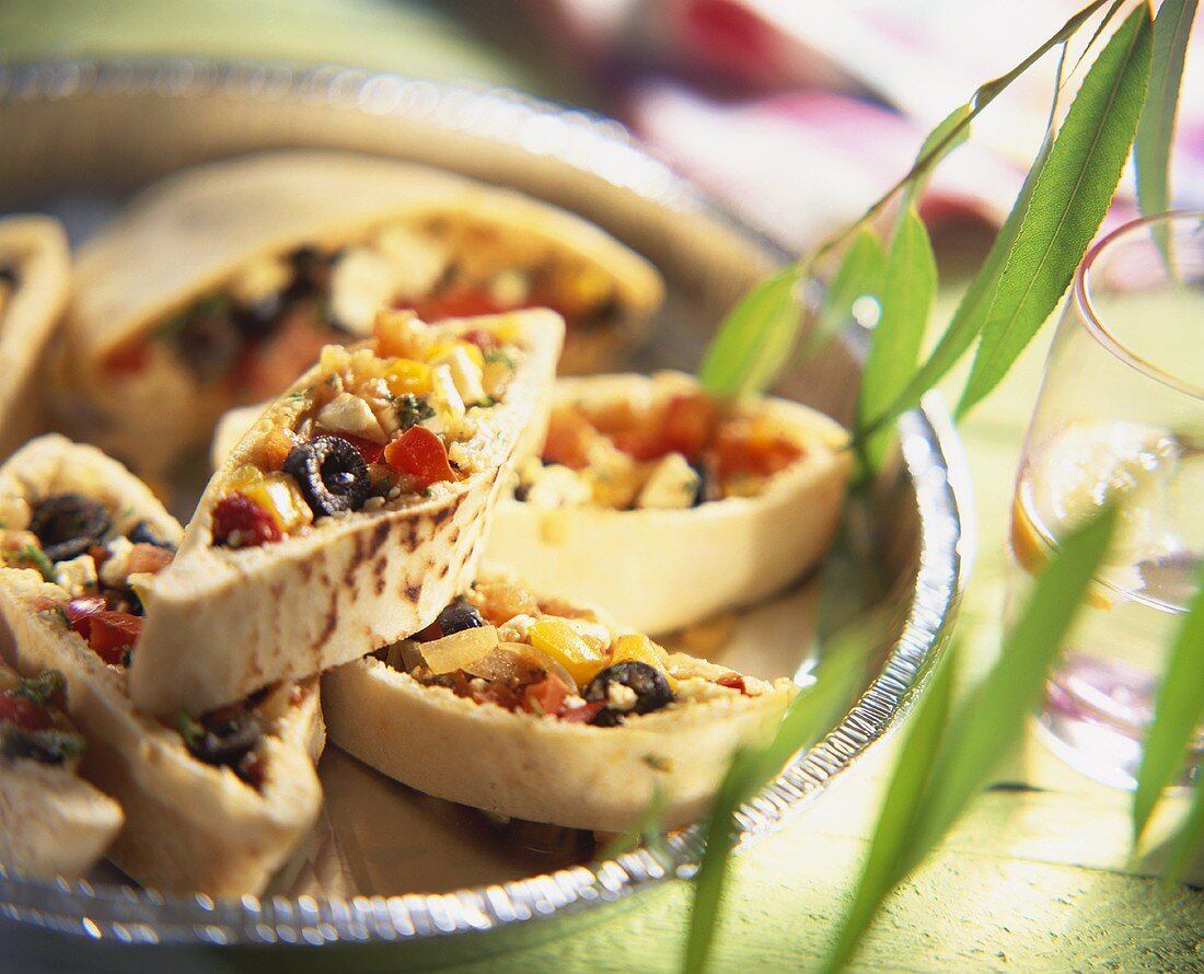 Pita bread filled with peppers, olives and sheep's cheese