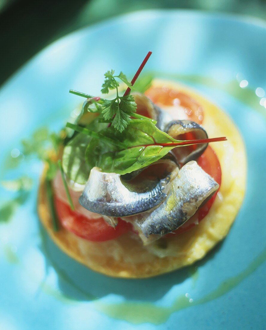 Onion confit and sardines on pastry base