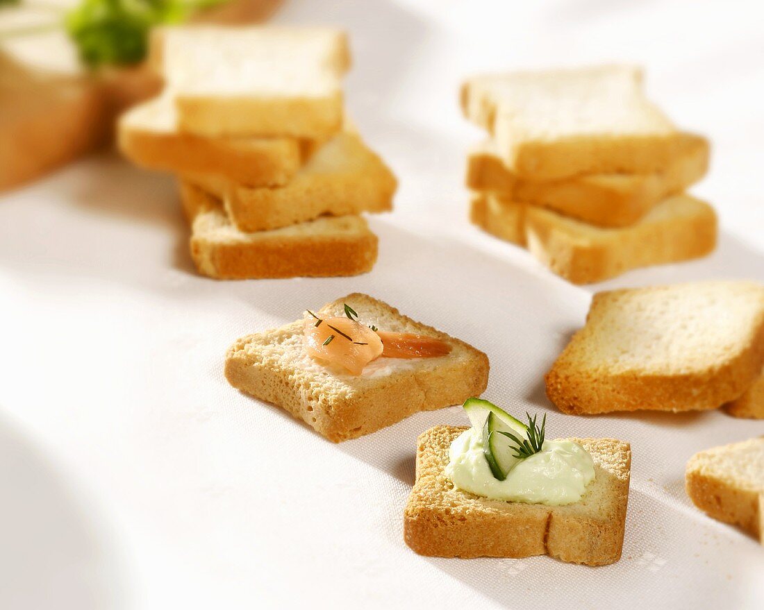 Smoked salmon & soft cheese & cucumber appetisers on tiny toast