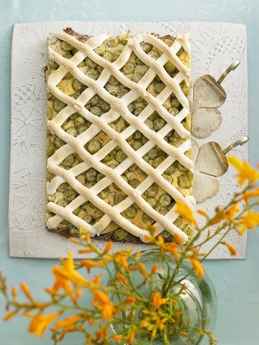 Gooseberry cake with meringue lattice
