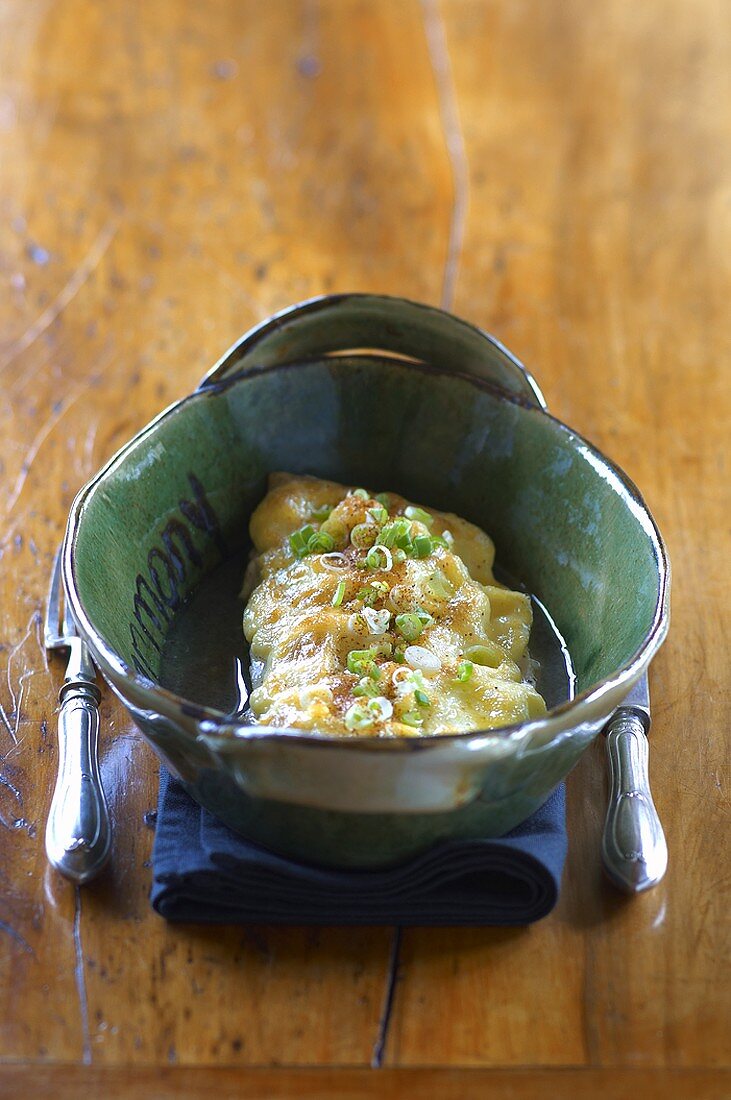 Baked fish fillet with spring onions