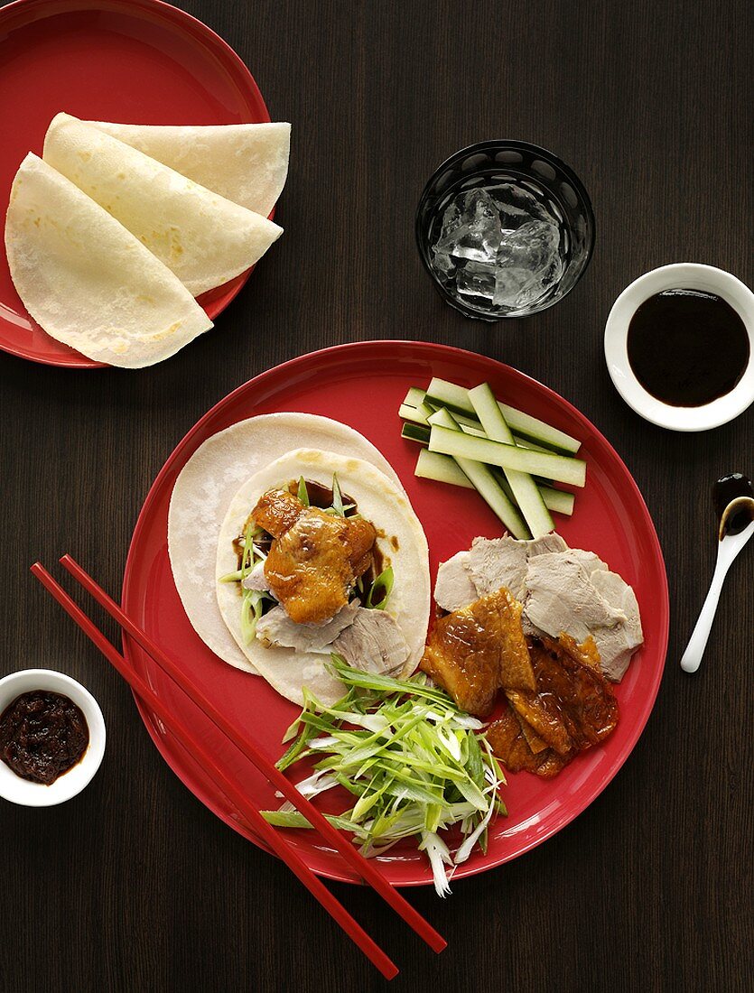 Peking duck with soy sauce and accompaniments (China)