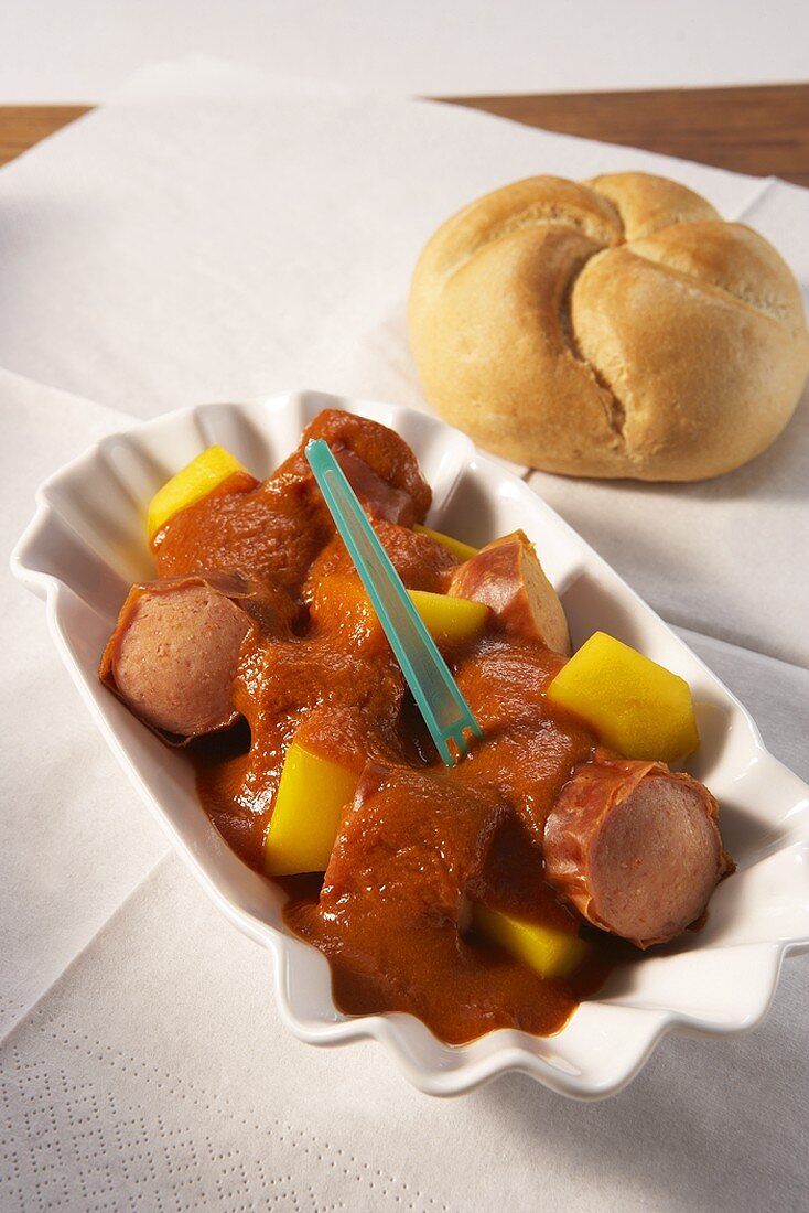 Currywurst (sliced sausage with curry sauce) with mango