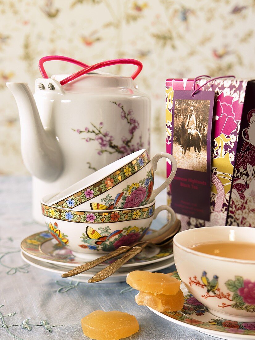 Ginger tea with teacups and teapot
