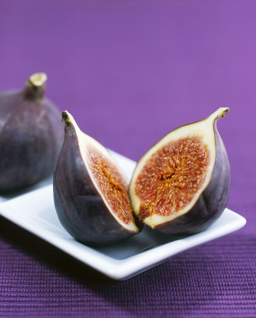 One whole and one halved fig