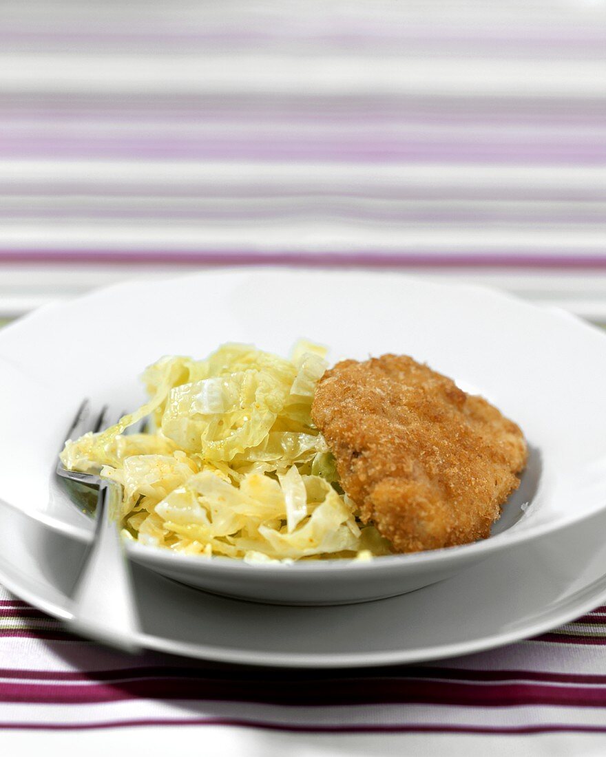 Breaded escalope with white cabbage salad