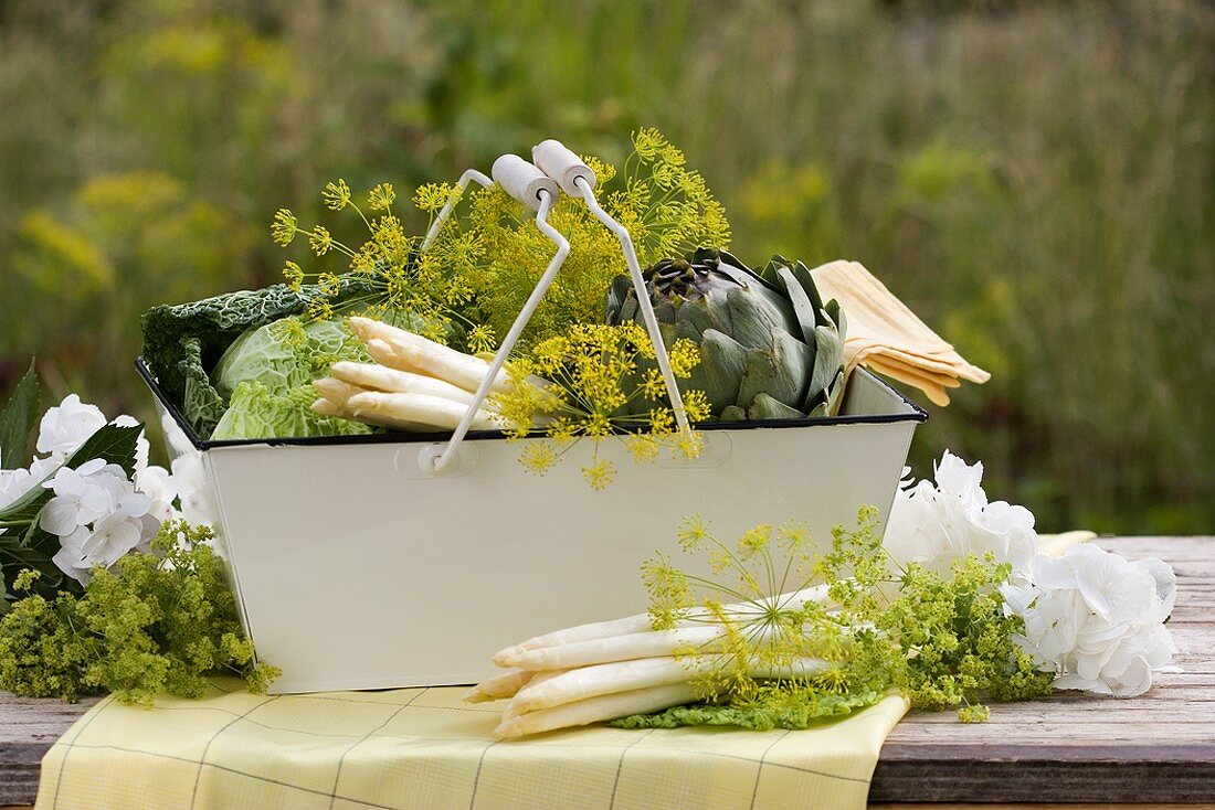 Dill, asparagus, savoy cabbage & artichoke in metal basket