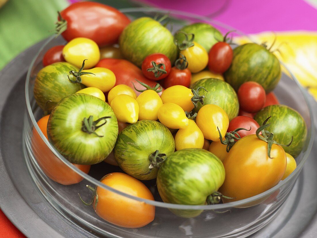 Various kinds of tomatoes in a glass dish