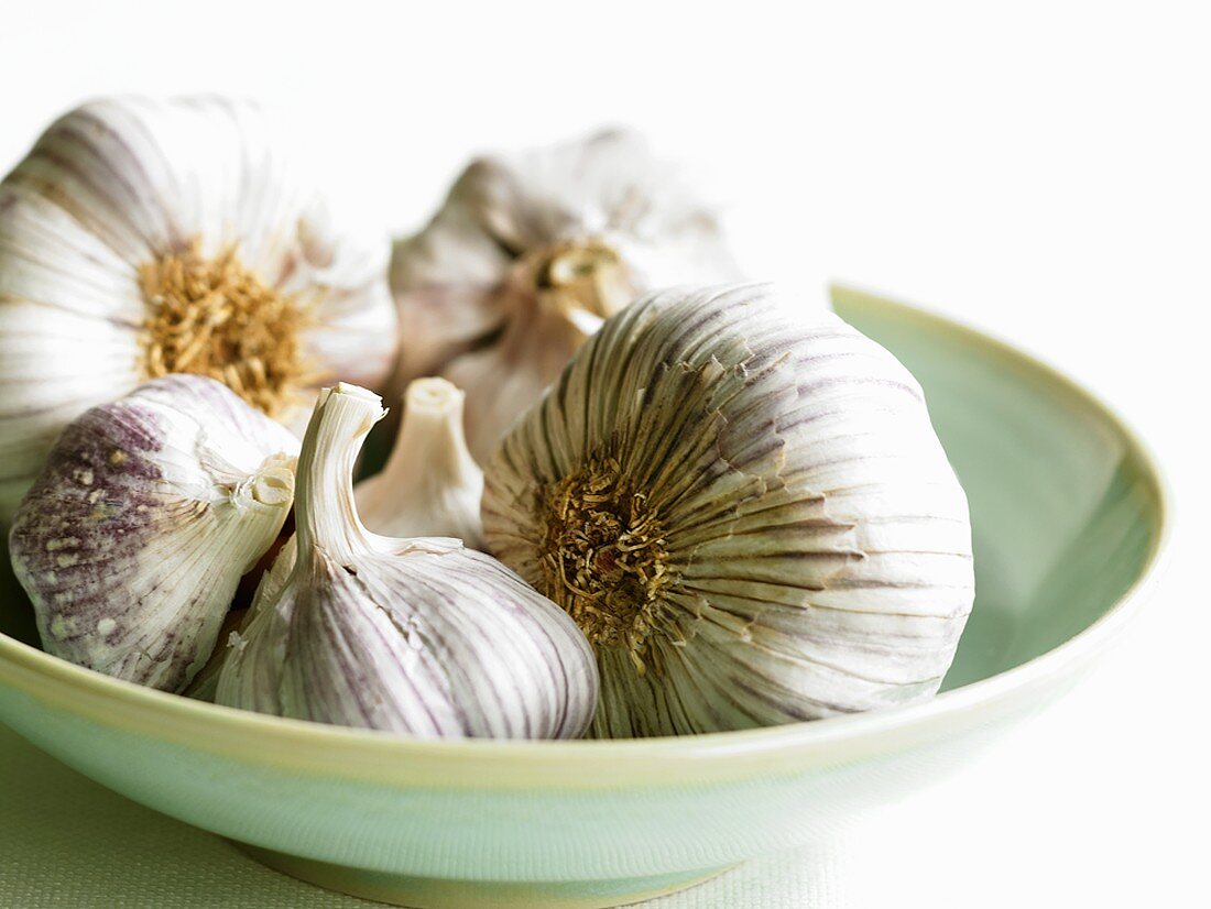 Garlic bulbs in a small dish