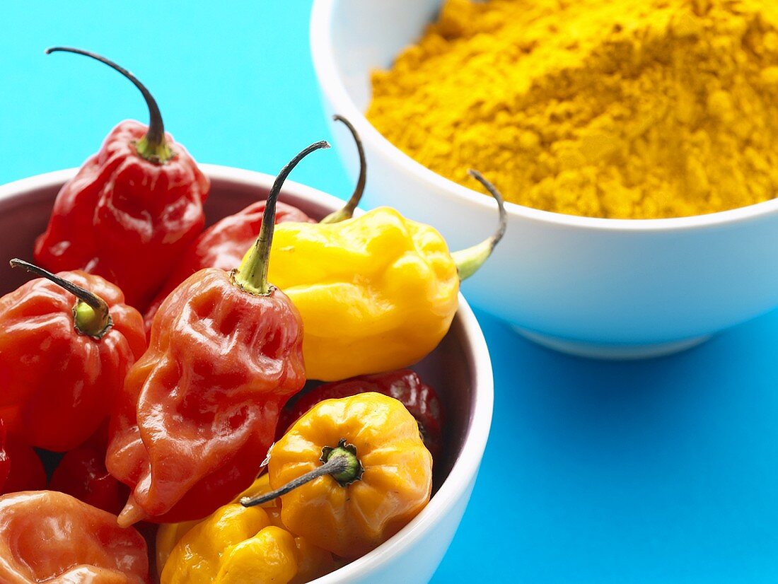 Peppers and turmeric in two small bowls