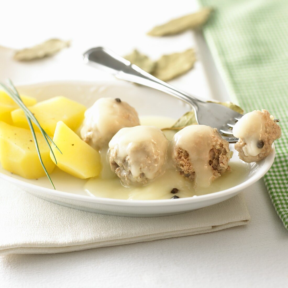 Königsberger Klopse (Königsberg meatballs) with boiled potatoes