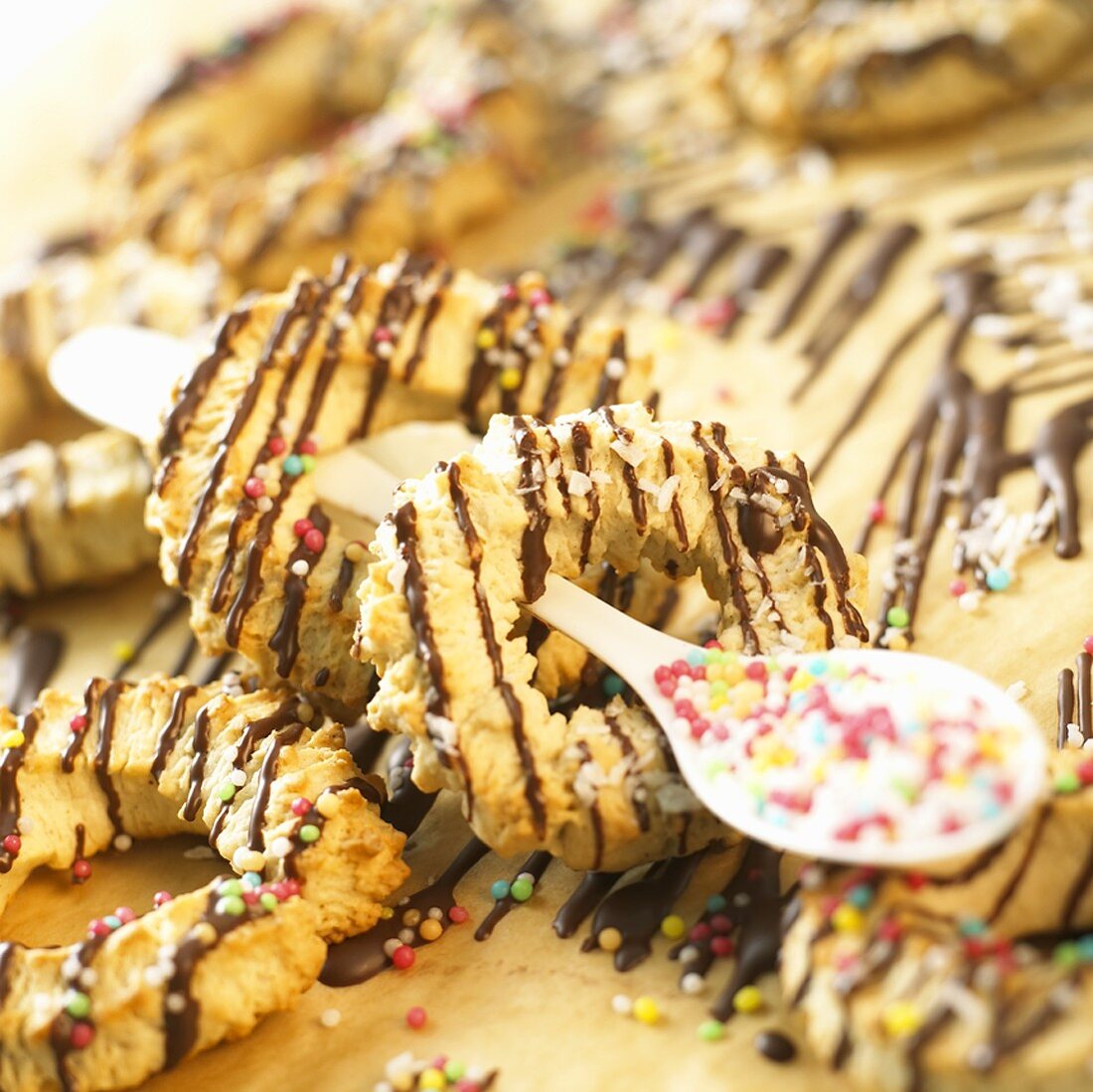 Almond rings with chocolate drizzle and sprinkles