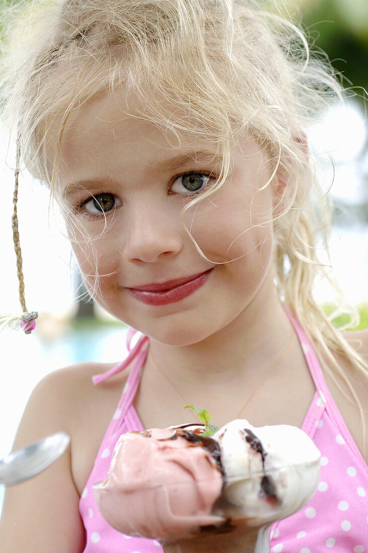 Blond girl with an ice cream sundae