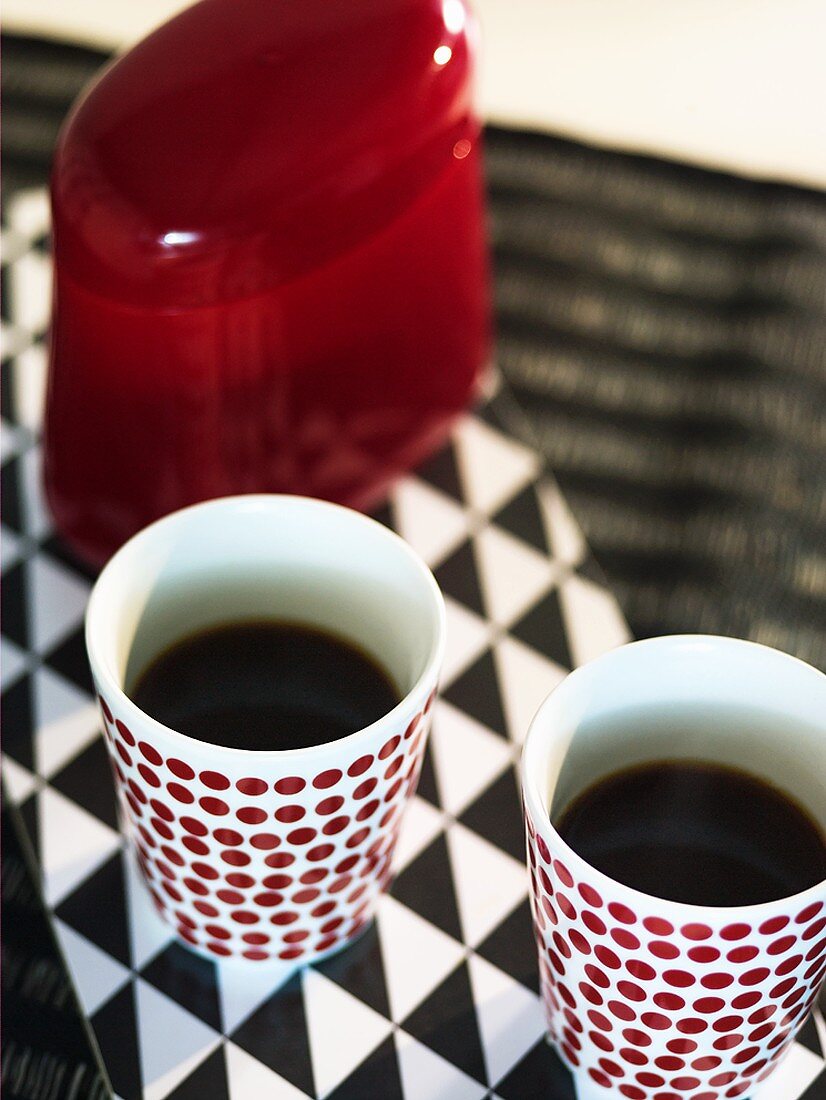 Two beakers of coffee
