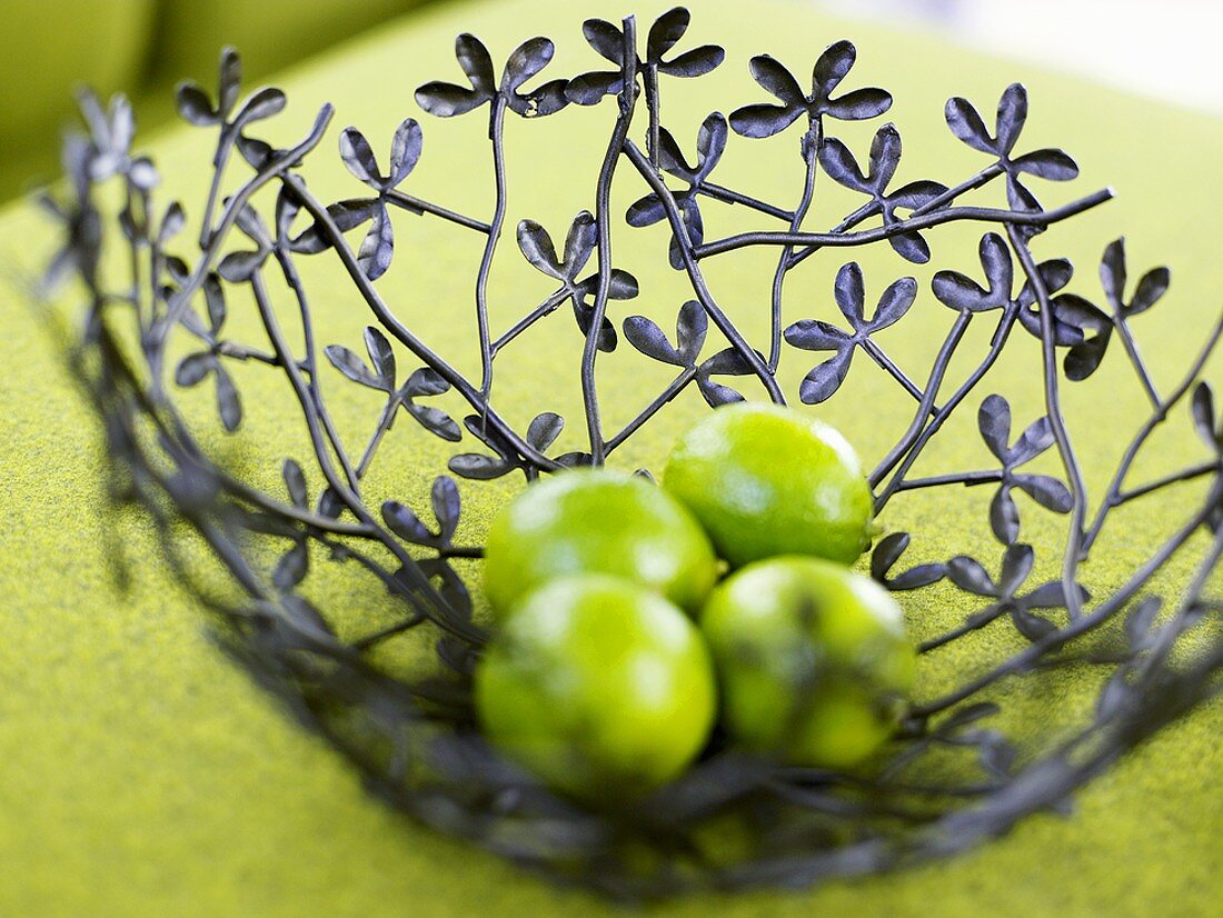Limes in decorative iron bowl