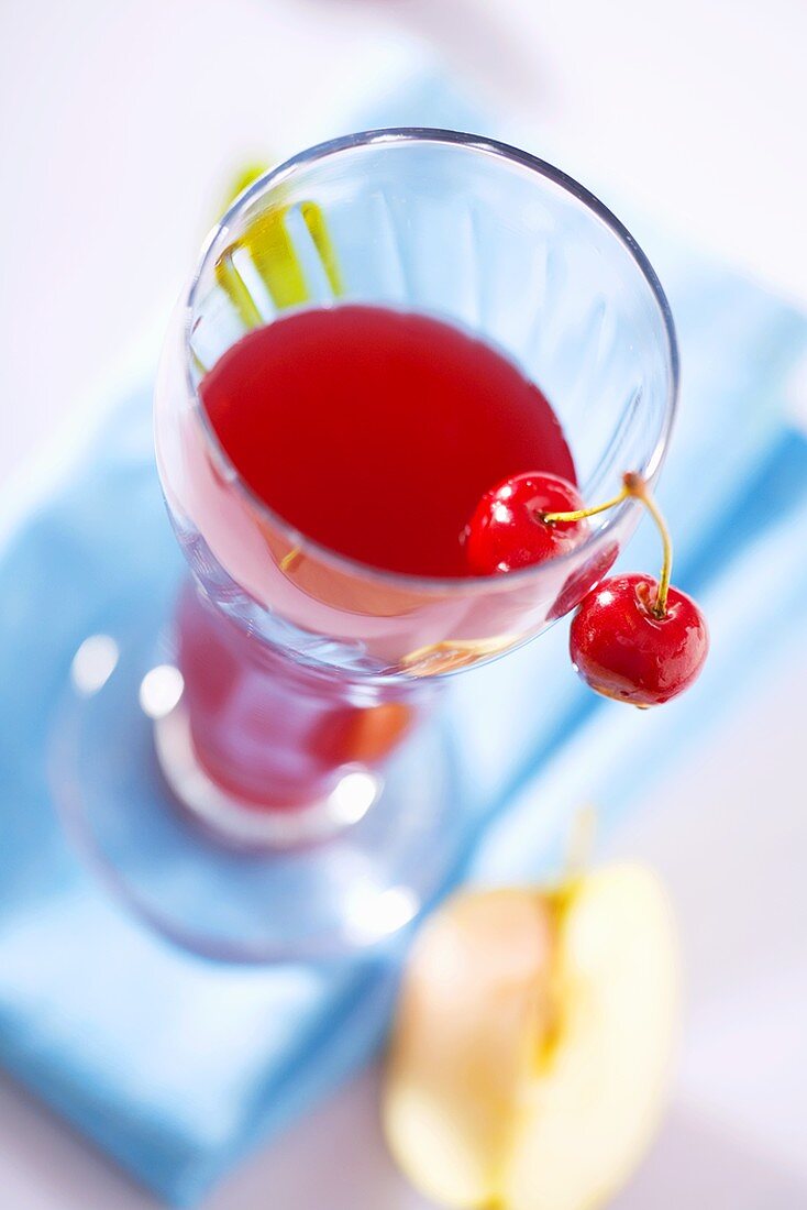 Apple and cherry juice in glass