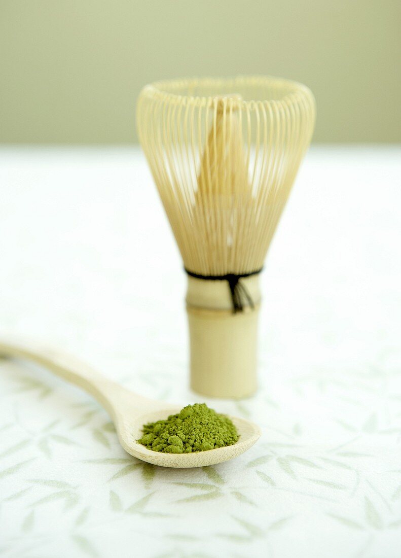 Matcha tea (powdered green tea, Japan) with tea whisk
