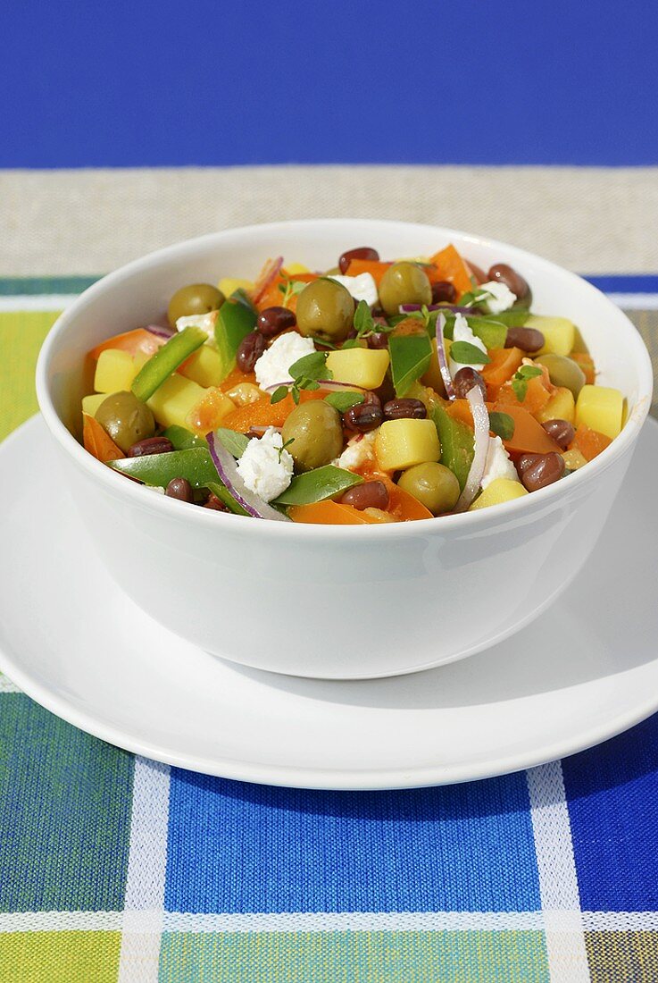Greek salad with potatoes, sheep's cheese and olives