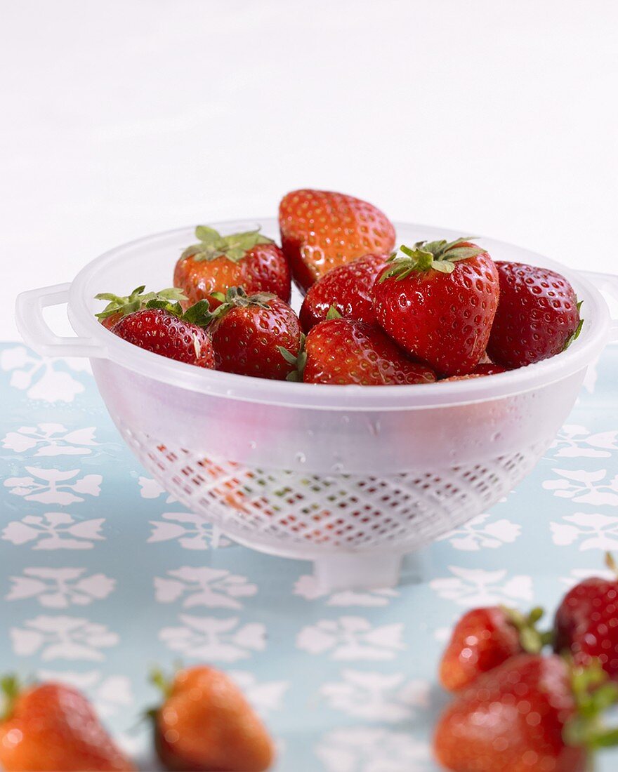 Fresh strawberries in colander