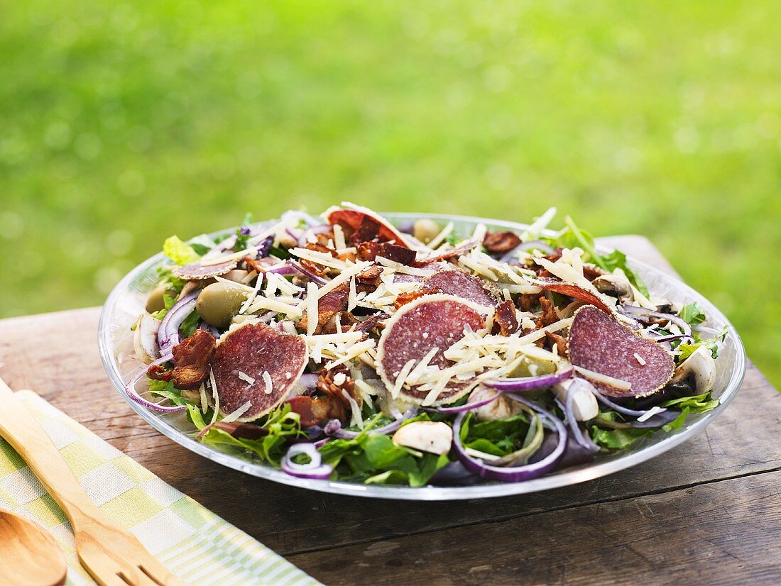 Salami salad with mushrooms, cheese and olives